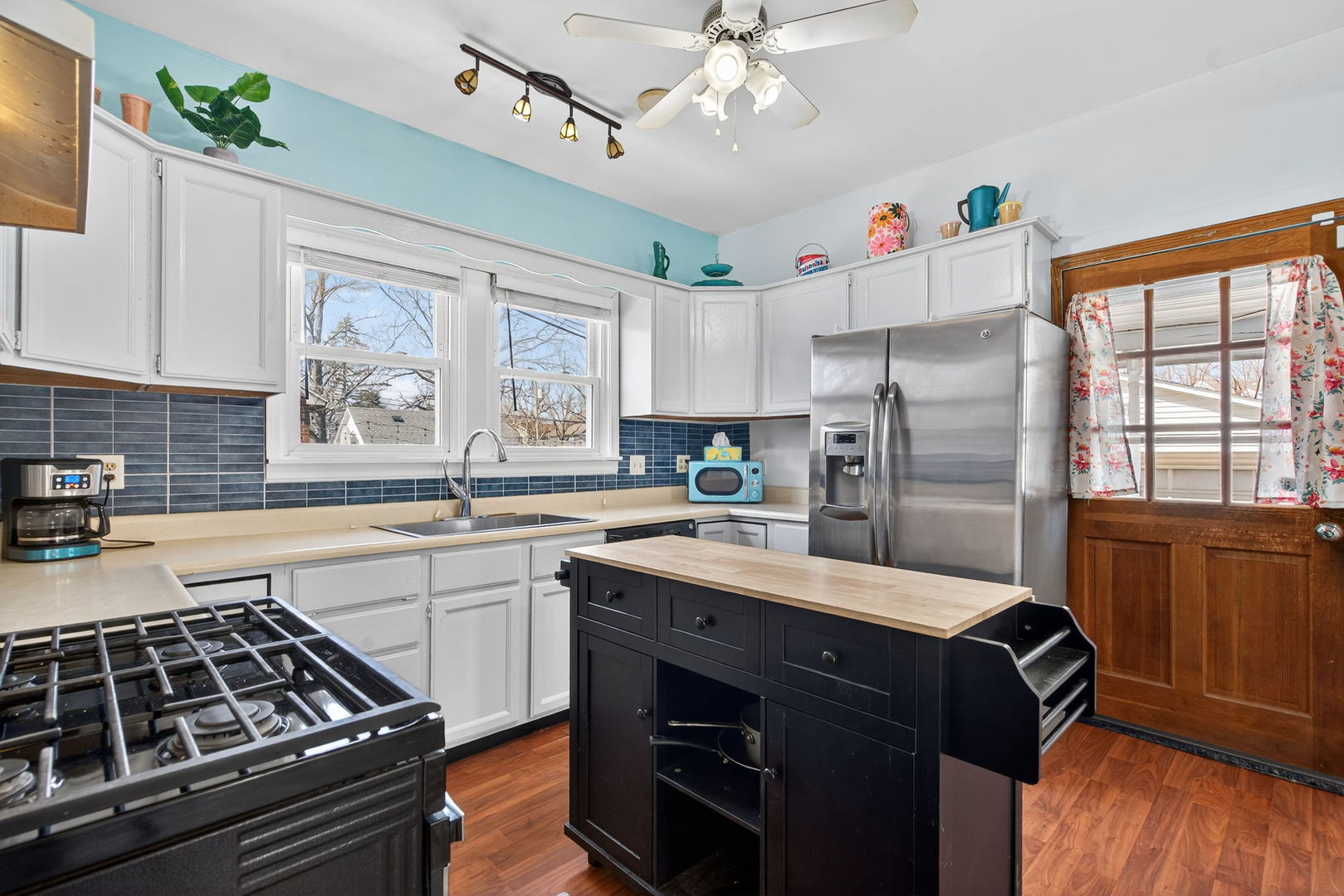 206 West Delaware Street Dwight, IL 60420 - Photo 17 of 42 a kitchen with a stove a sink and a refrigerator