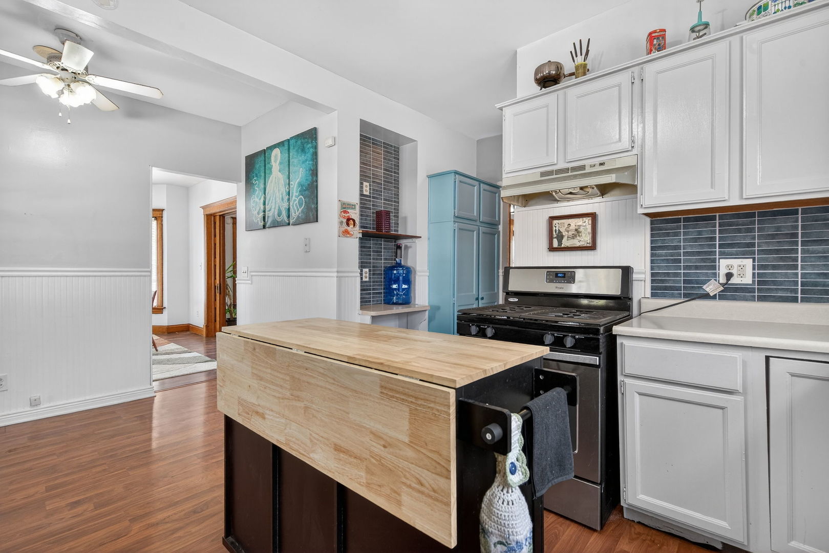 206 West Delaware Street Dwight, IL 60420 - Photo 22 of 42 a kitchen with a stove a sink and a refrigerator