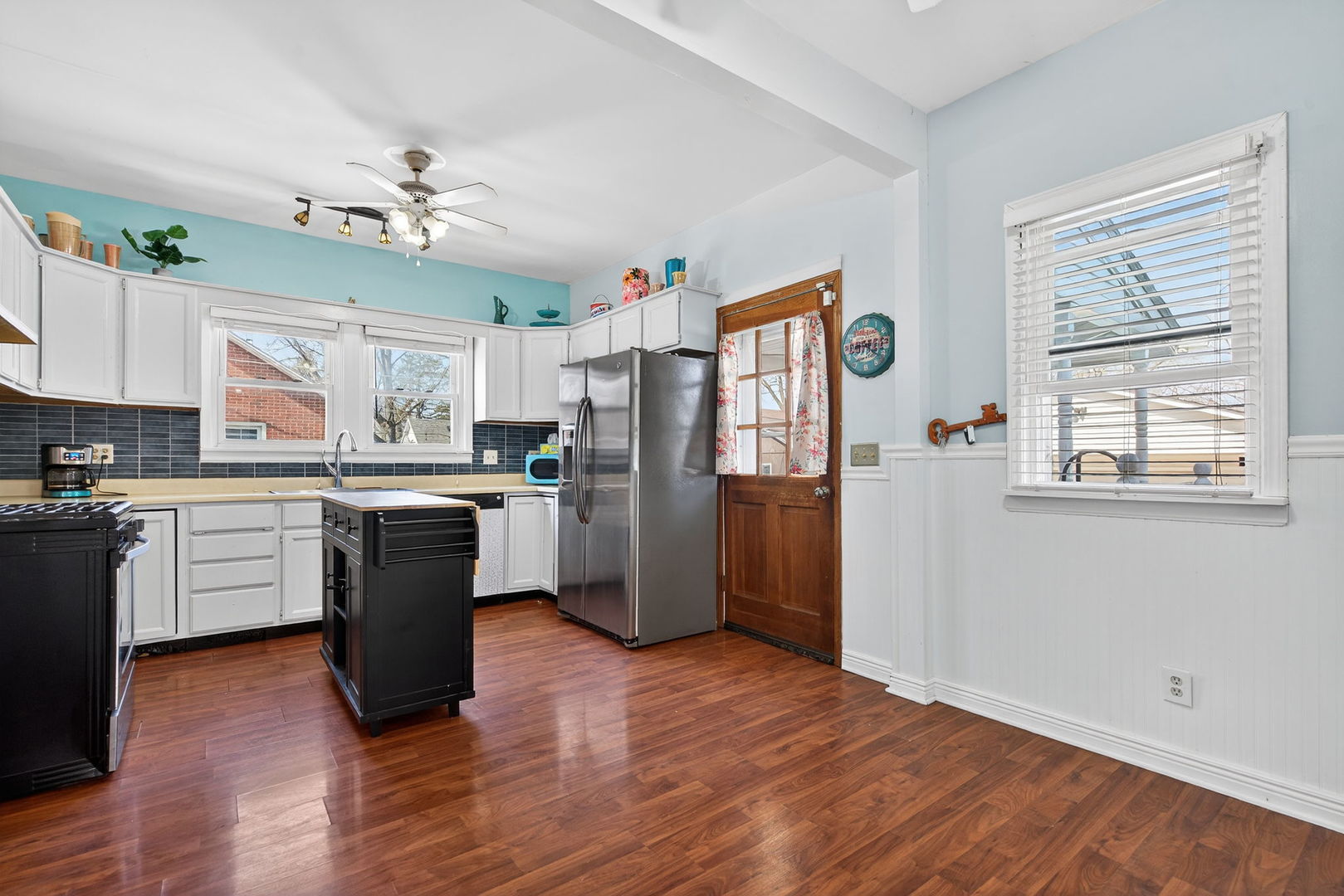 206 West Delaware Street Dwight, IL 60420 - Photo 23 of 42 a kitchen with stainless steel appliances granite countertop a refrigerator a sink dishwasher a stove with wooden floor and cabinets