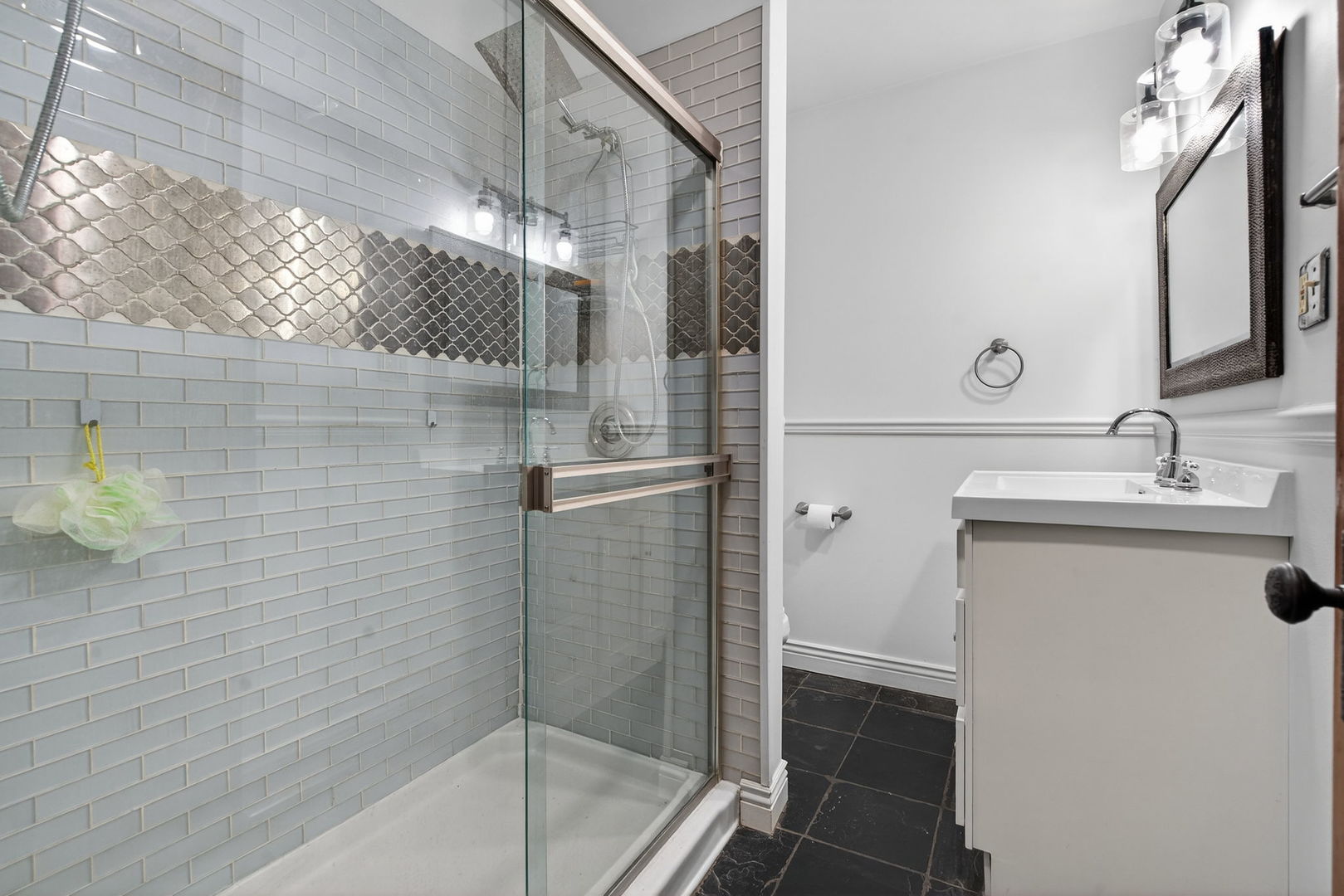 206 West Delaware Street Dwight, IL 60420 - Photo 26 of 42 a bathroom with a shower and a sink