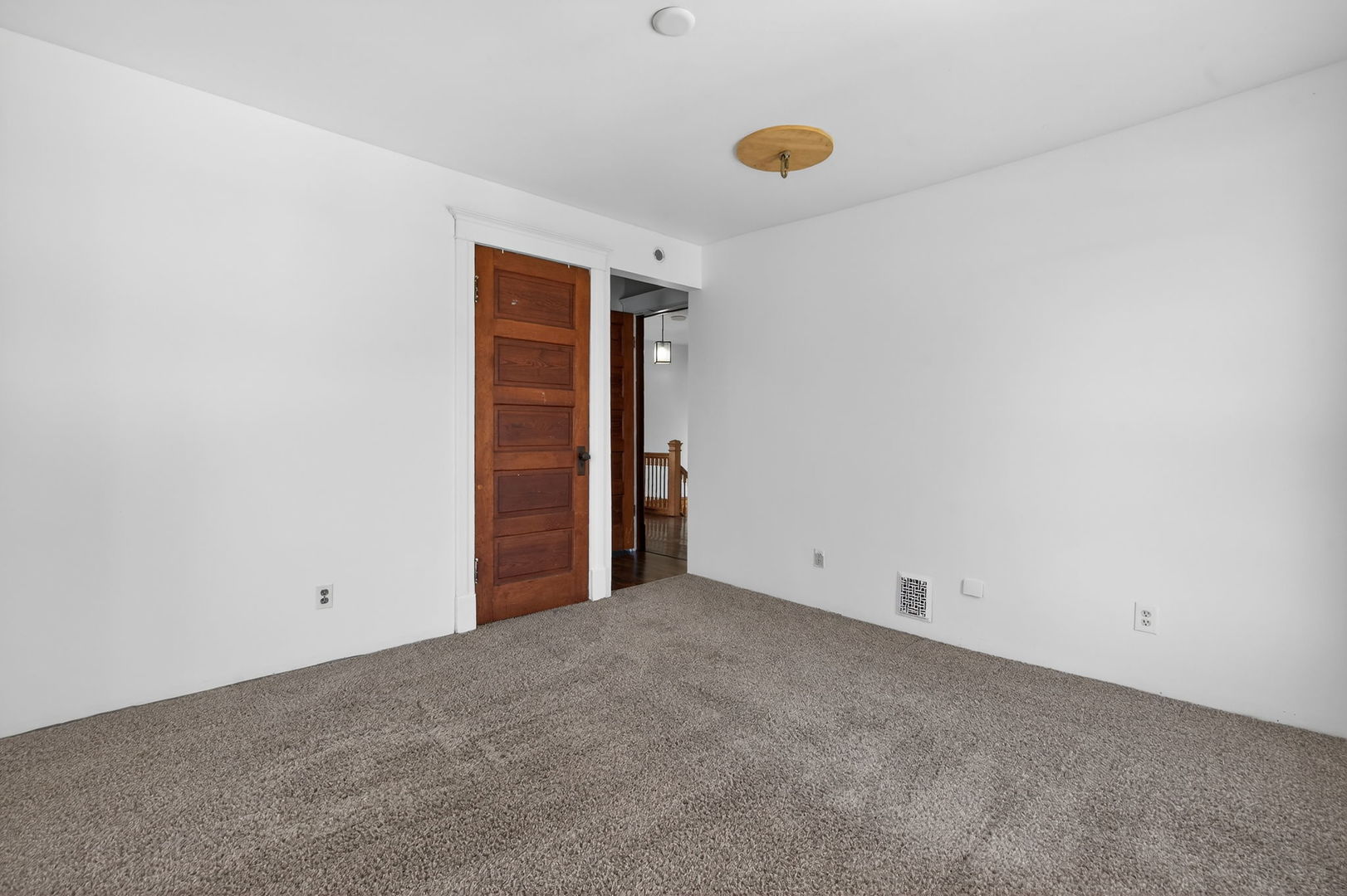 206 West Delaware Street Dwight, IL 60420 - Photo 27 of 42 an empty room with closet and a window