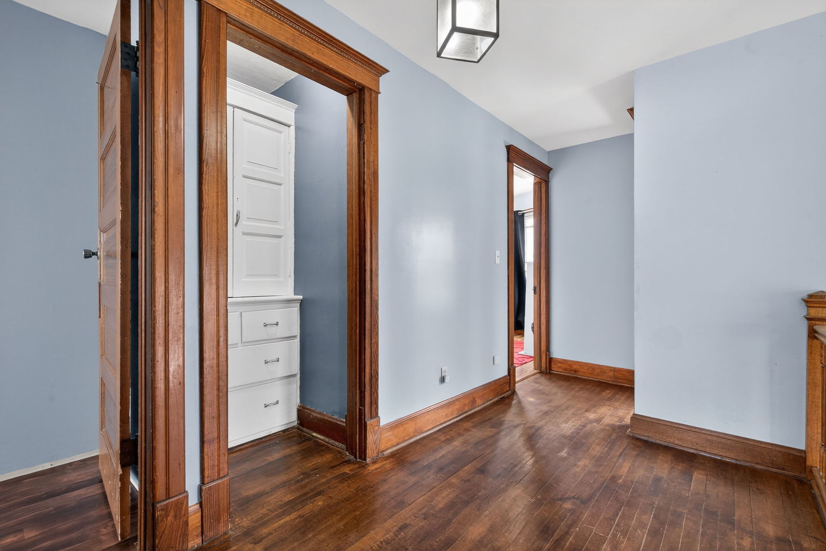 206 West Delaware Street Dwight, IL 60420 - Photo 29 of 42 an empty room with wooden floor and windows
