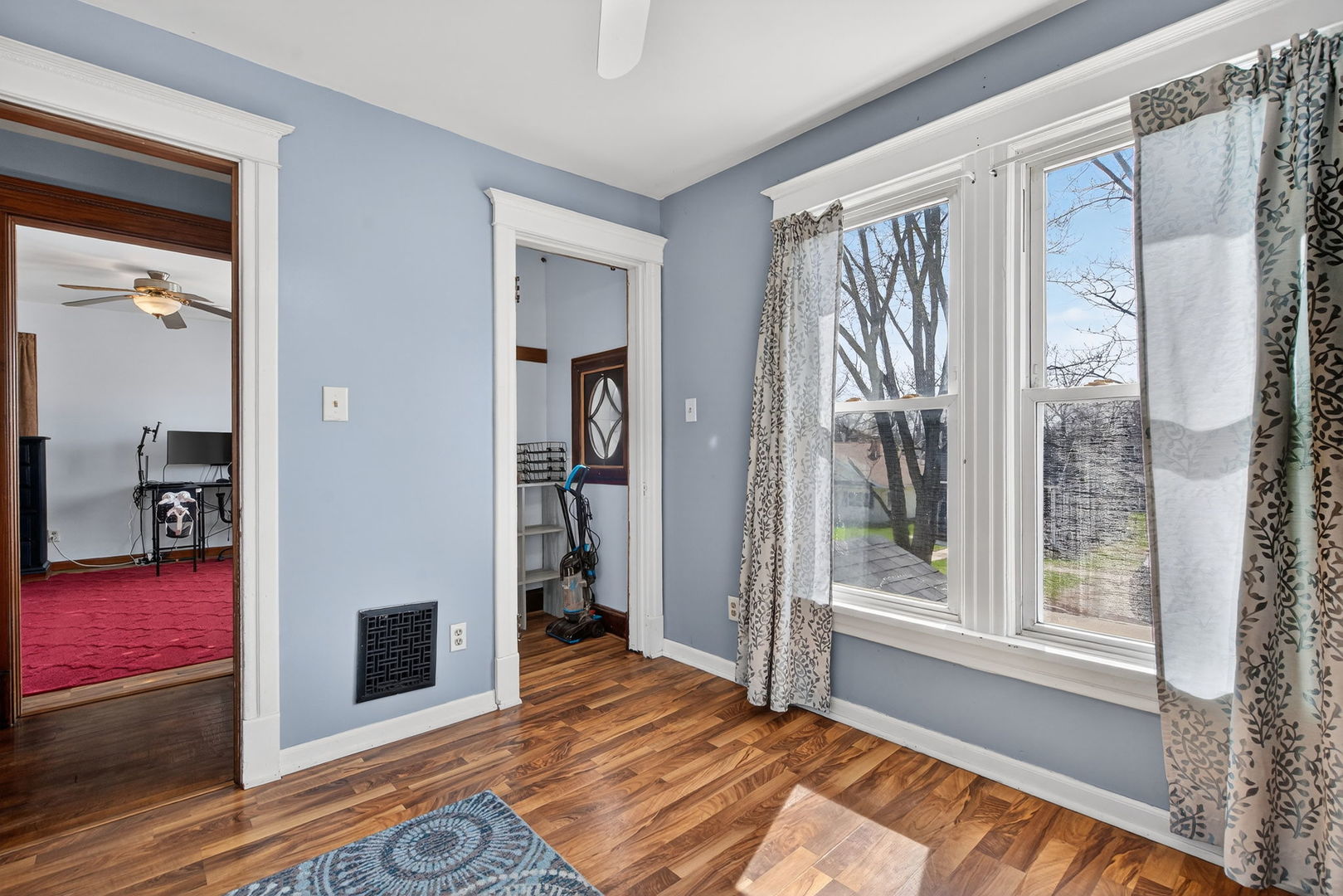 206 West Delaware Street Dwight, IL 60420 - Photo 30 of 42 a view of a livingroom with wooden floor and a bedroom