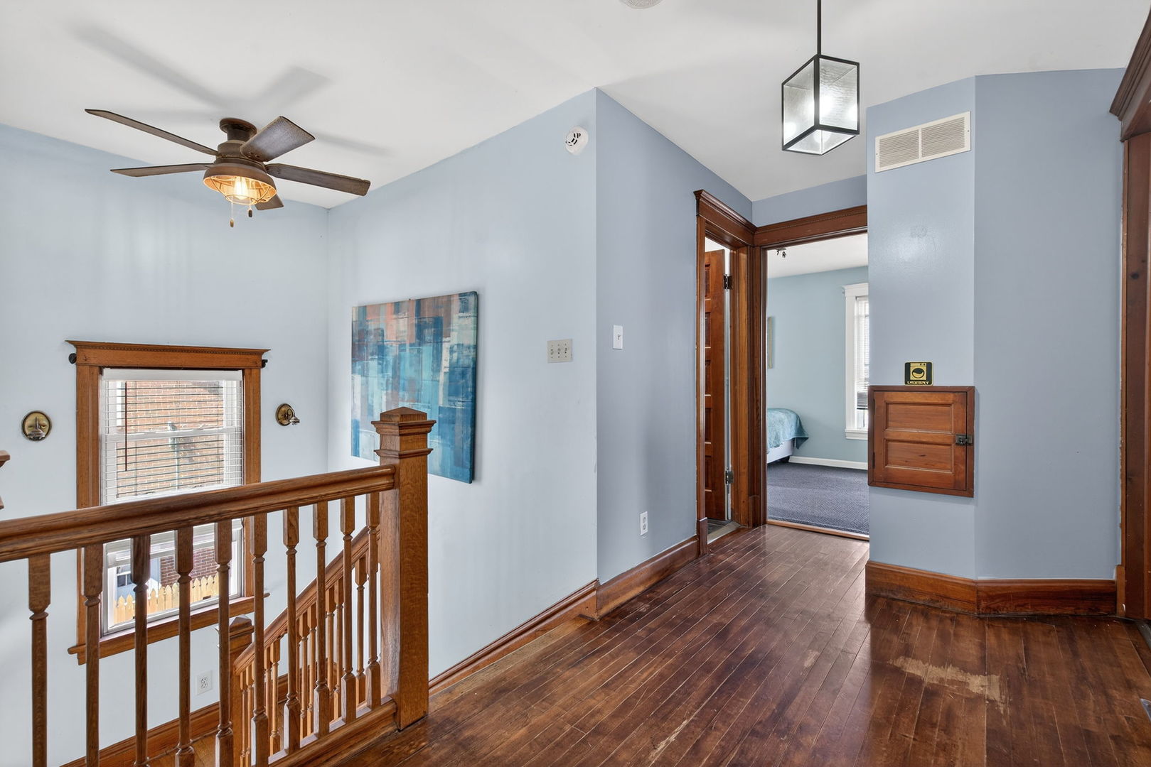 206 West Delaware Street Dwight, IL 60420 - Photo 31 of 42 a view of a livingroom with wooden floor and a ceiling fan