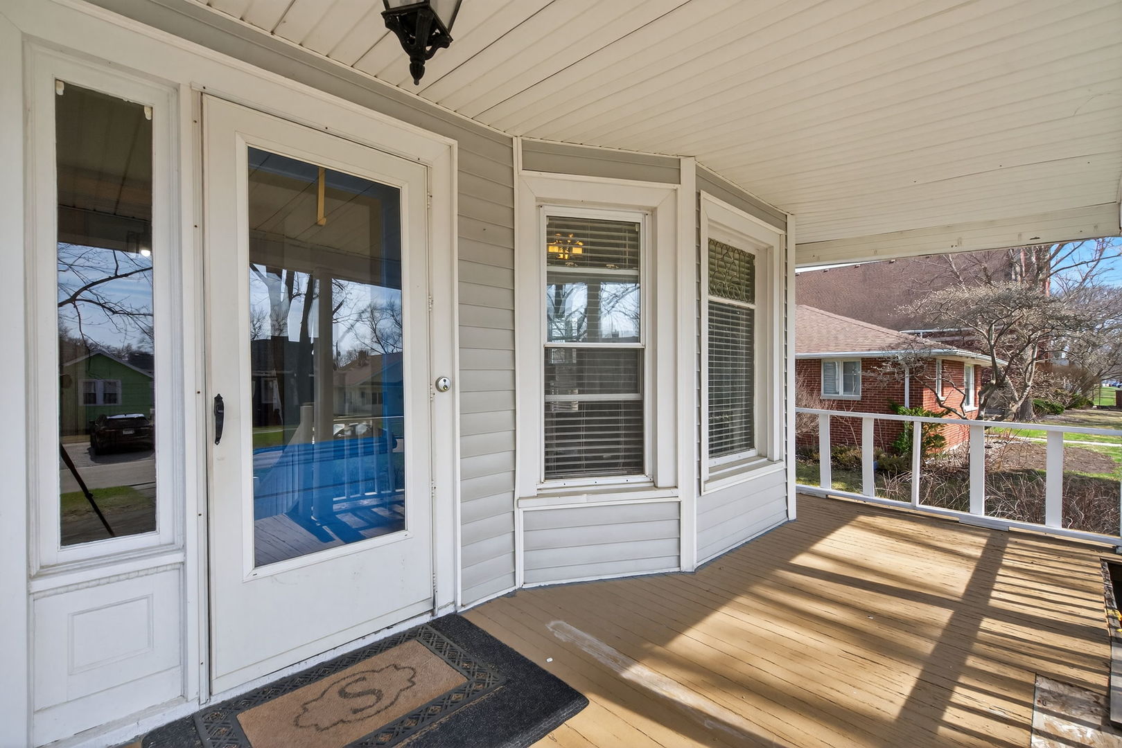 206 West Delaware Street Dwight, IL 60420 - Photo 4 of 42 a view of a balcony with wooden floor and windows