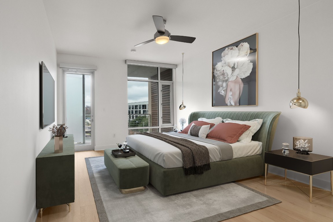 a bedroom with a bed and a chandelier