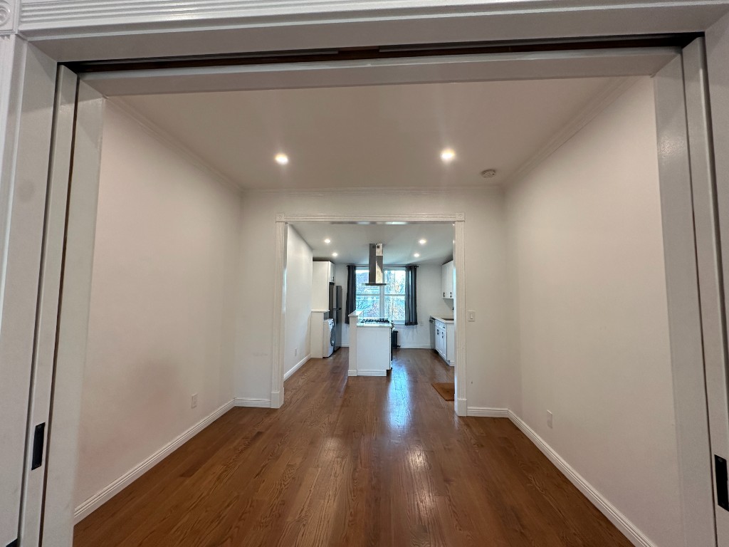 60 Union Street, Unit 4 Brooklyn, NY 11231 - Photo 6 of 8 a view of a hallway with wooden floor and staircase
