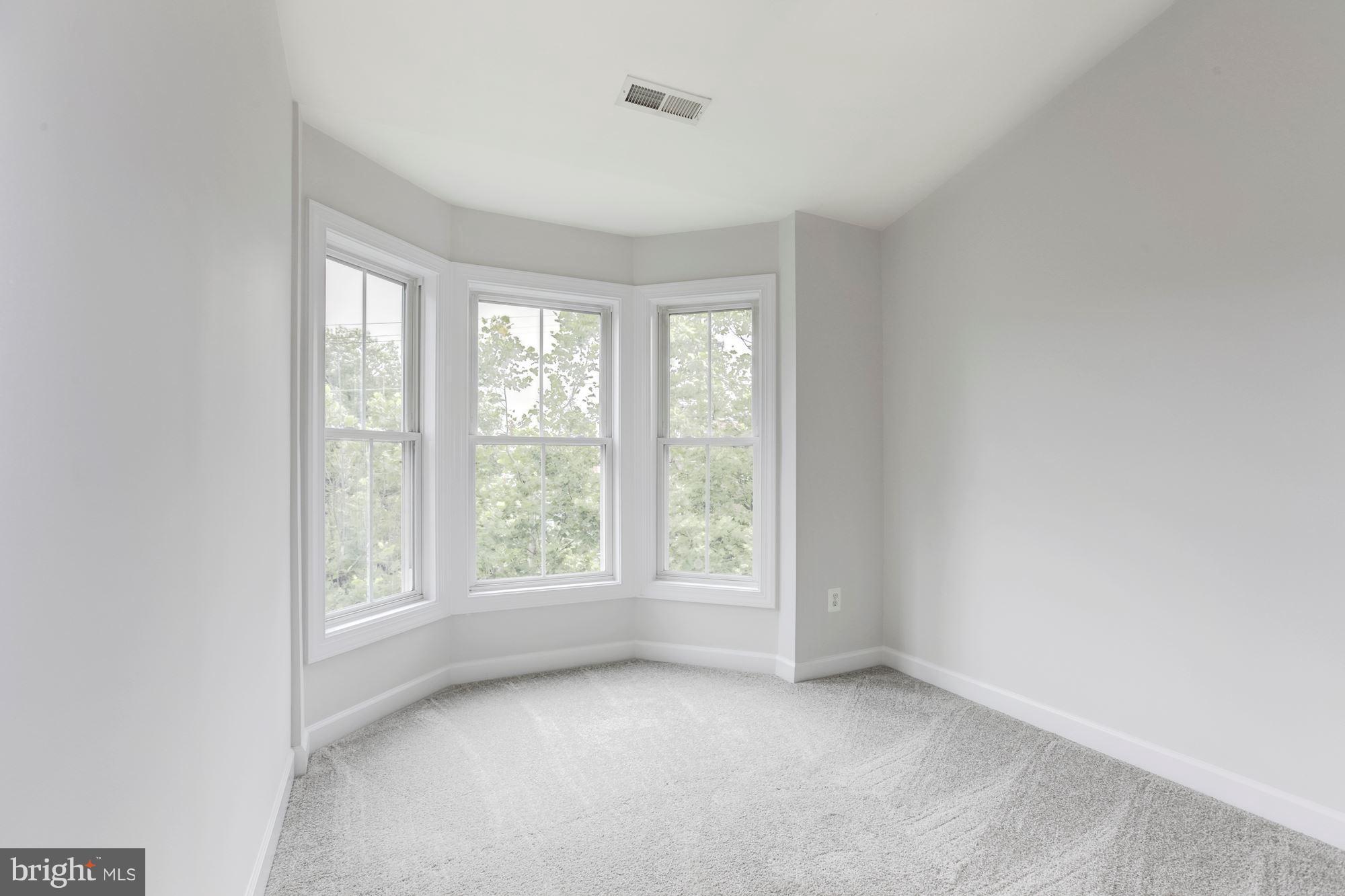2316 Plyers Mill Road Silver Spring, MD 20902 - Photo 18 of 24 a view of an empty room with a window