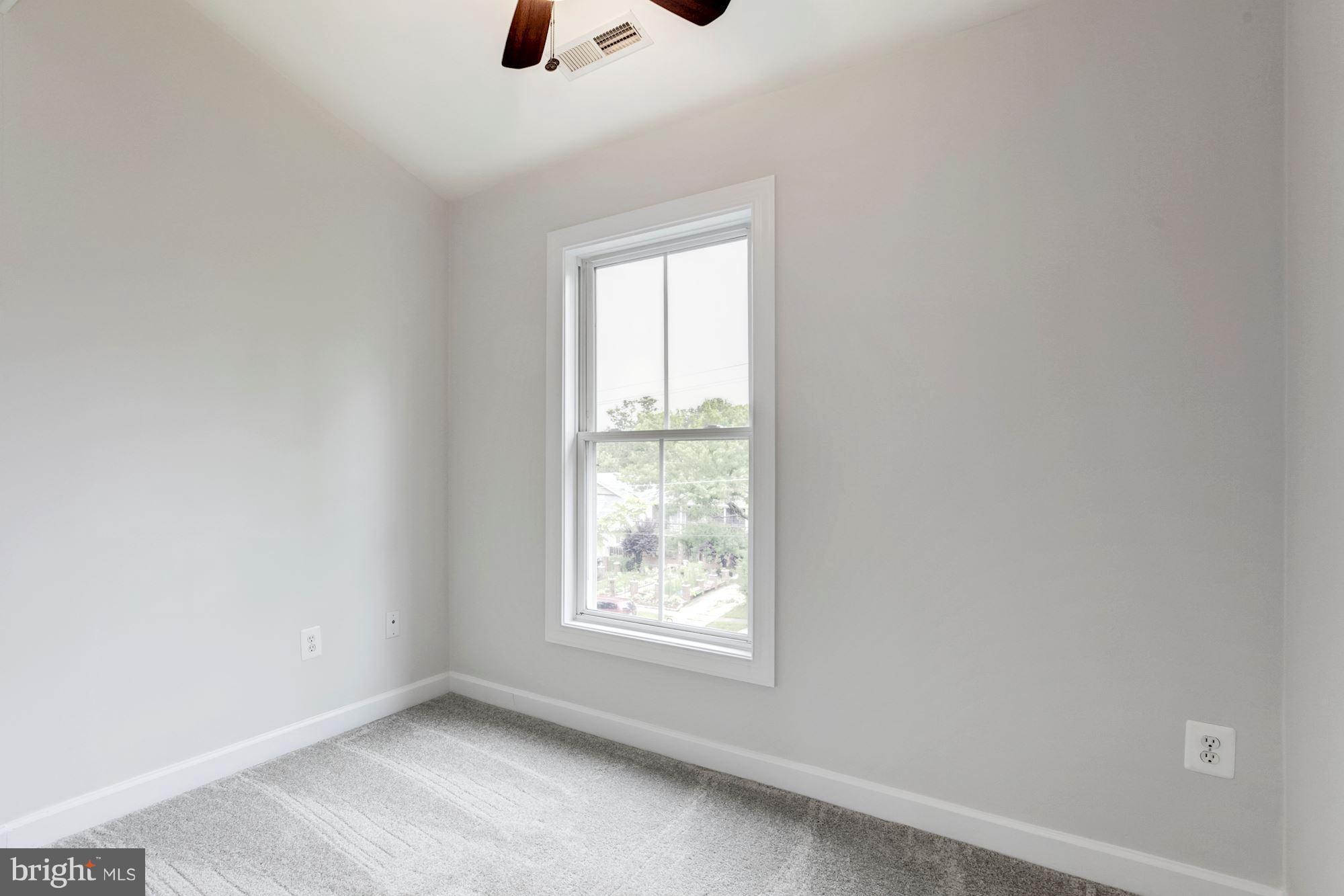 2316 Plyers Mill Road Silver Spring, MD 20902 - Photo 19 of 24 an empty room with windows