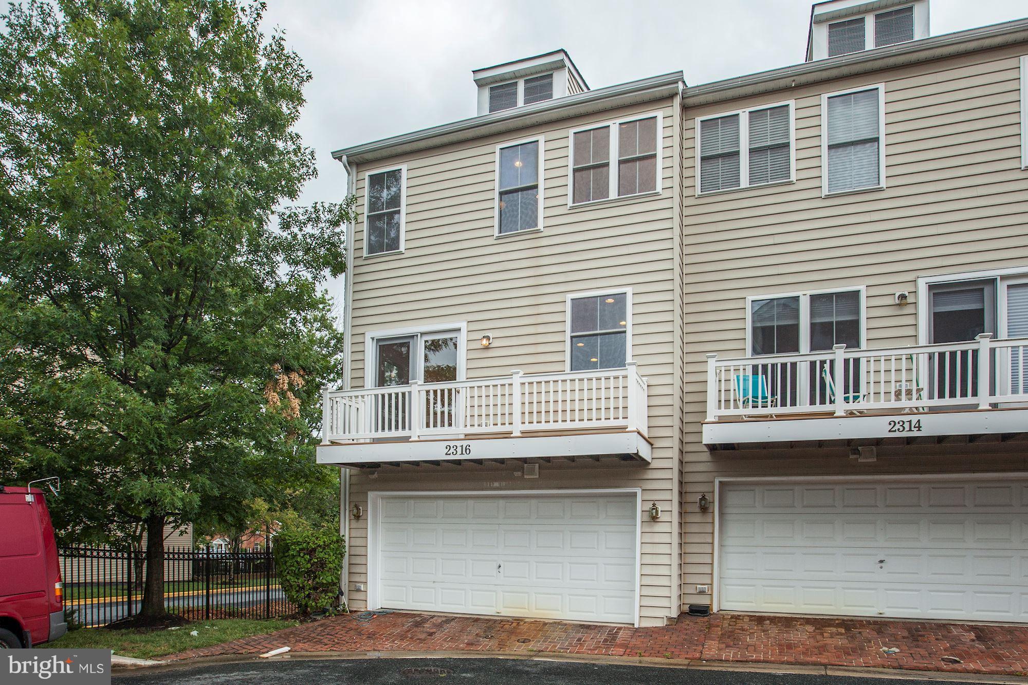 2316 Plyers Mill Road Silver Spring, MD 20902 - Photo 20 of 24 a front view of a house with a garage