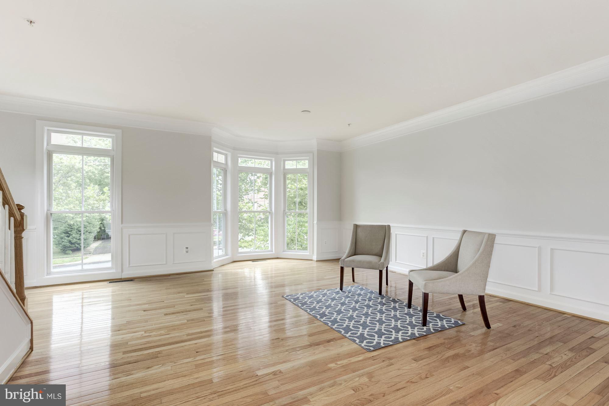 2316 Plyers Mill Road Silver Spring, MD 20902 - Photo 5 of 24 a living room with furniture and a wooden floor