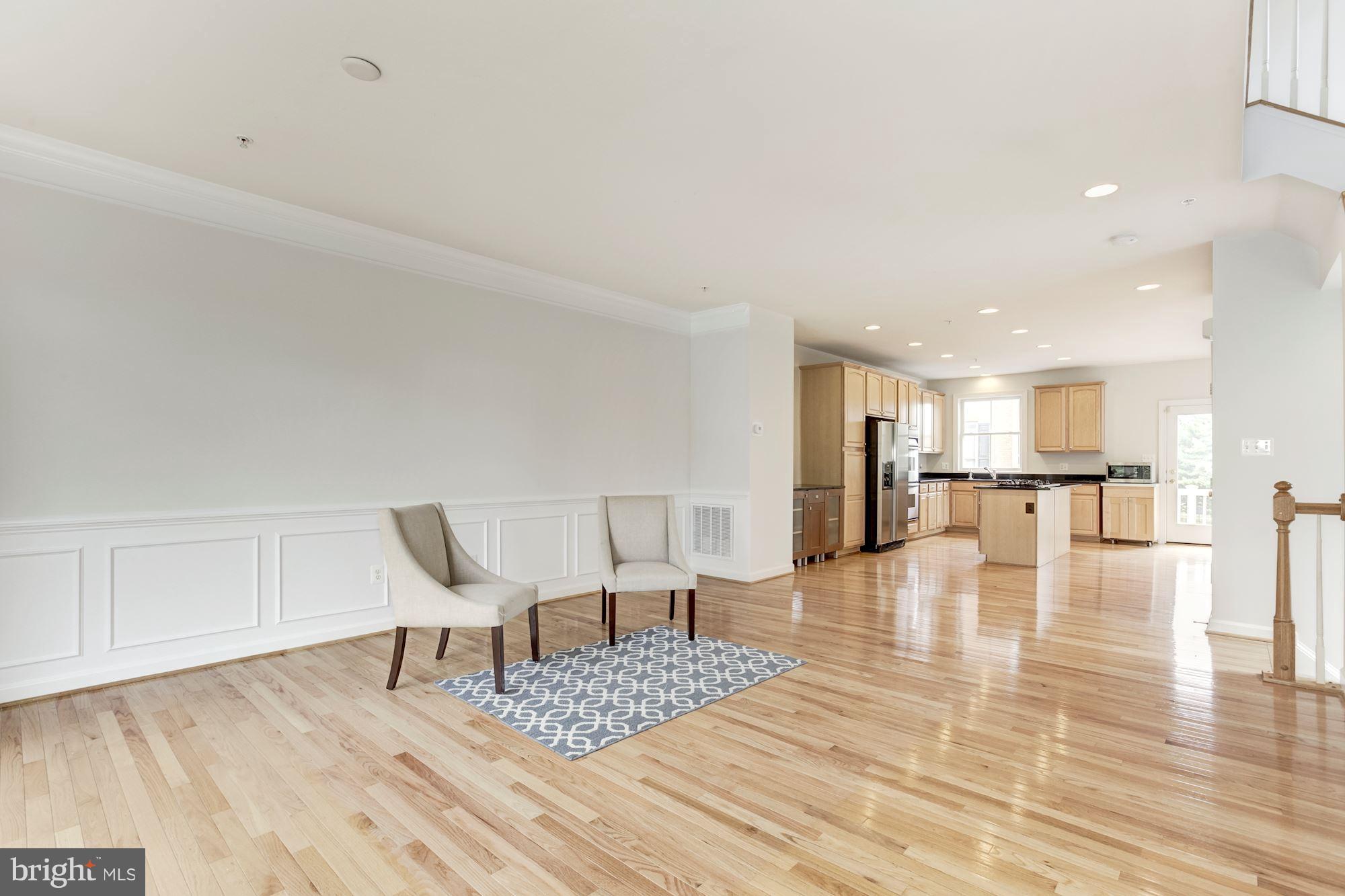 2316 Plyers Mill Road Silver Spring, MD 20902 - Photo 6 of 24 a living room with furniture and a table with wooden floor