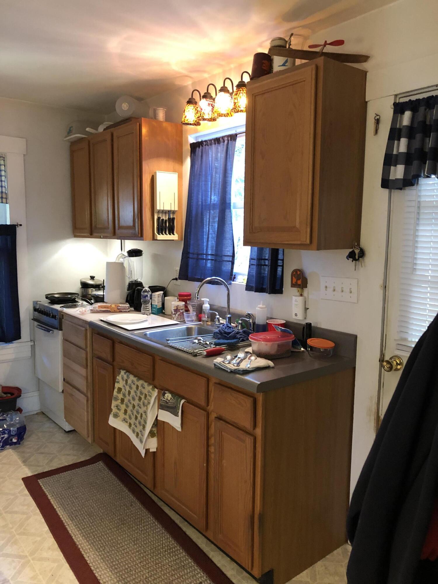 3716 Ventnor Road Southeast Roanoke, VA 24014 - Photo 8 of 26 a kitchen with stainless steel appliances granite countertop a sink stove and refrigerator