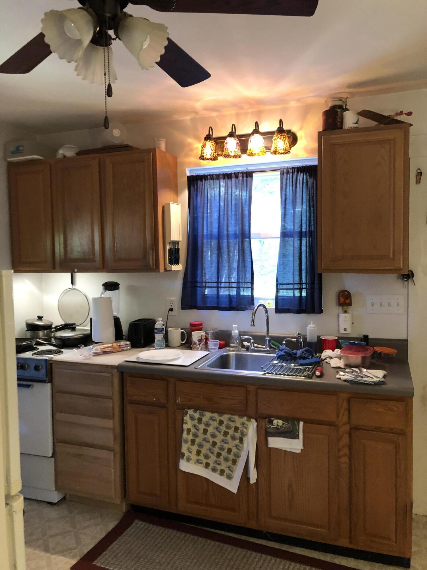 3716 Ventnor Road Southeast Roanoke, VA 24014 - Photo 9 of 26 a kitchen with stainless steel appliances granite countertop a sink a stove and cabinets