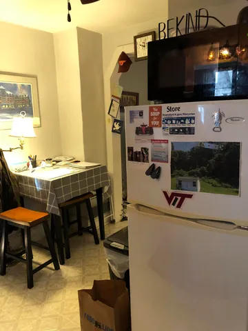 a view of a living room with furniture and a flat screen tv
