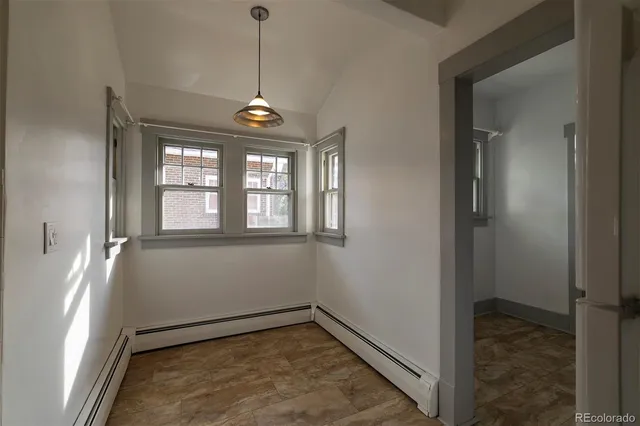 a view of an empty room with a window