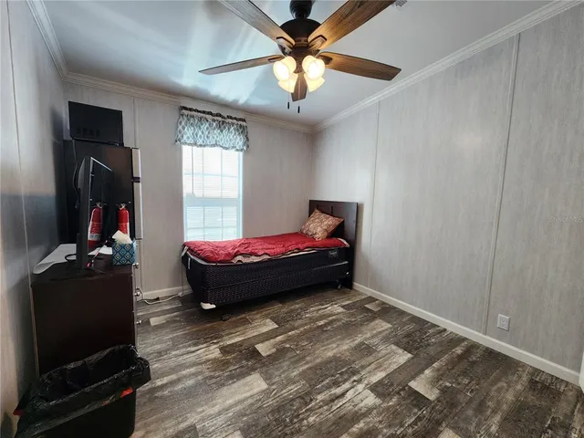 a bed room with a bed and a window