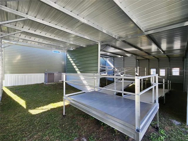 a view of a chairs and table in the patio