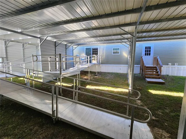 a view of a swimming pool with a patio