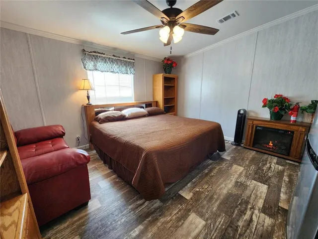 a bedroom with bed and window