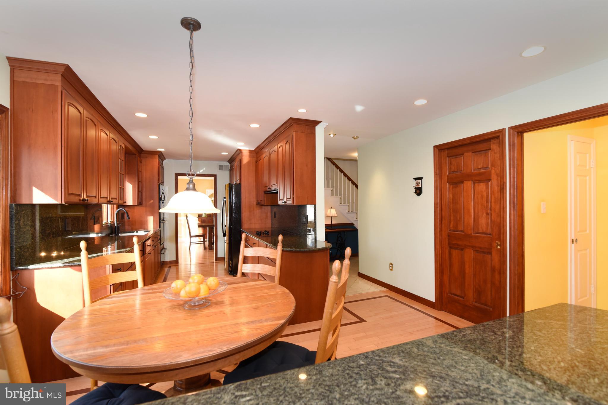 2208 Spinnaker Court Reston, VA 20191 - Photo 12 of 39 a dining room with furniture and wooden floor