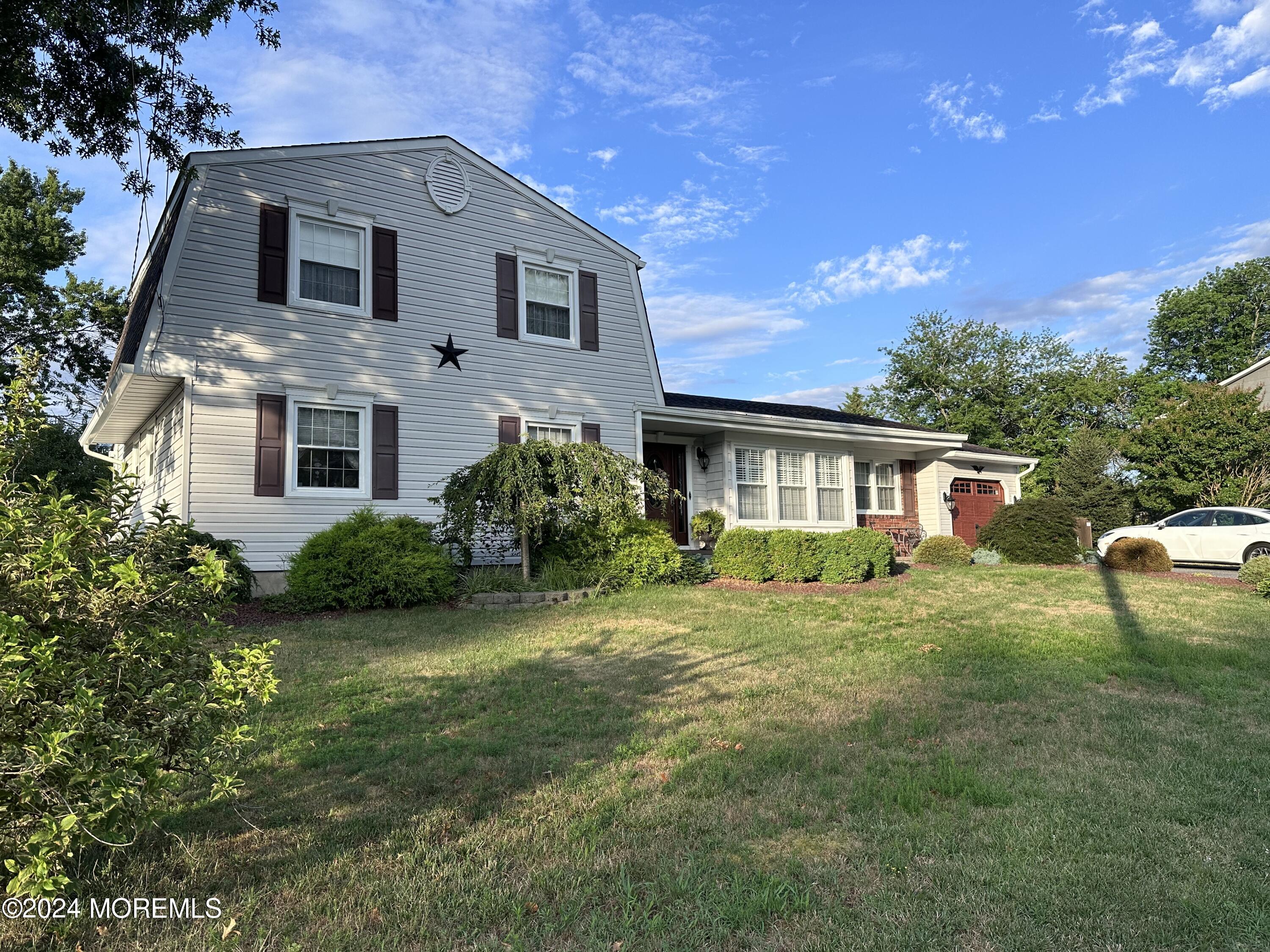 a view of a yard in front of a house with a yard