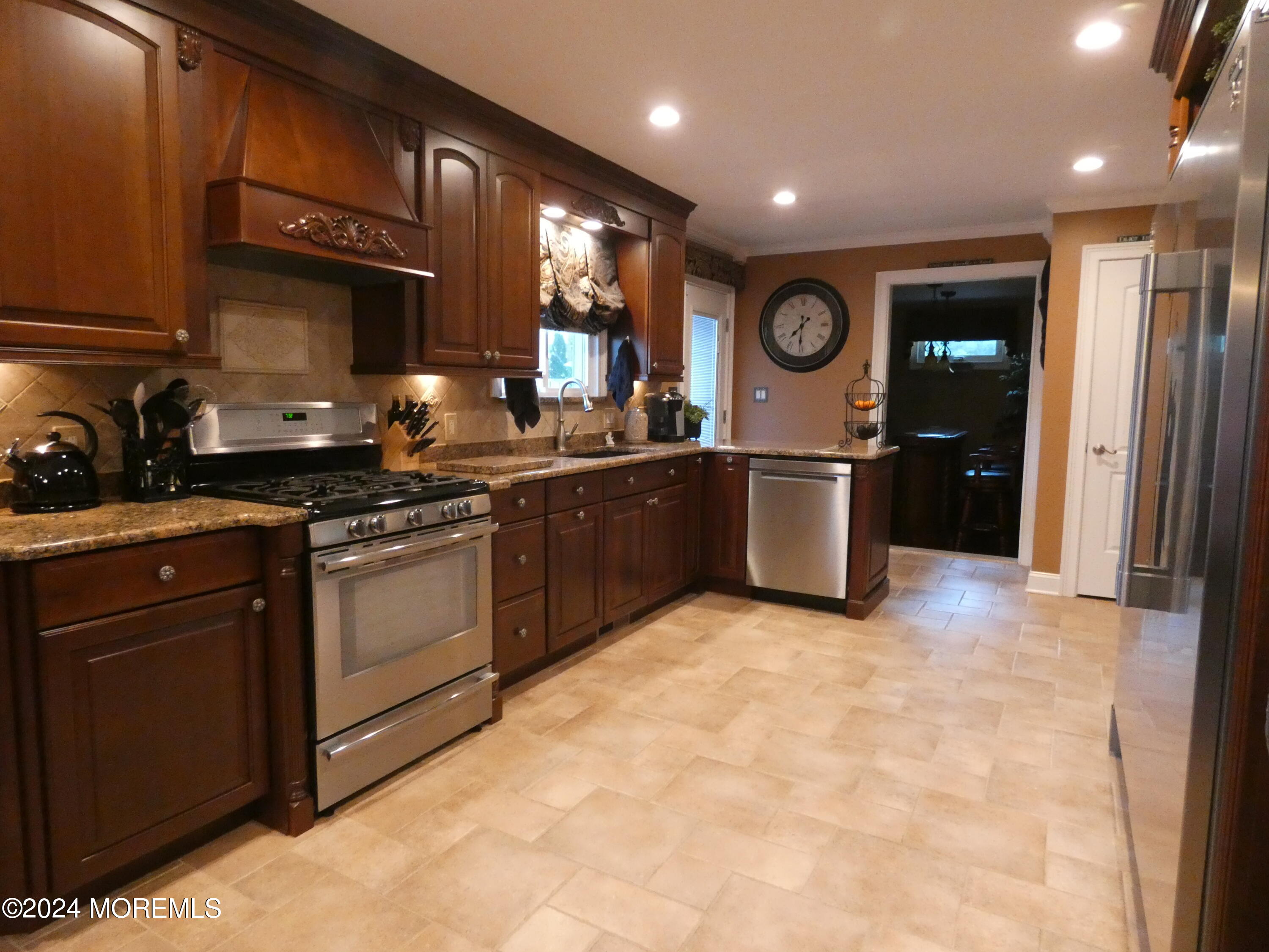 3 Springhill Drive Howell, NJ 07731 - Photo 13 of 37 a kitchen with stainless steel appliances granite countertop a stove a sink and a refrigerator