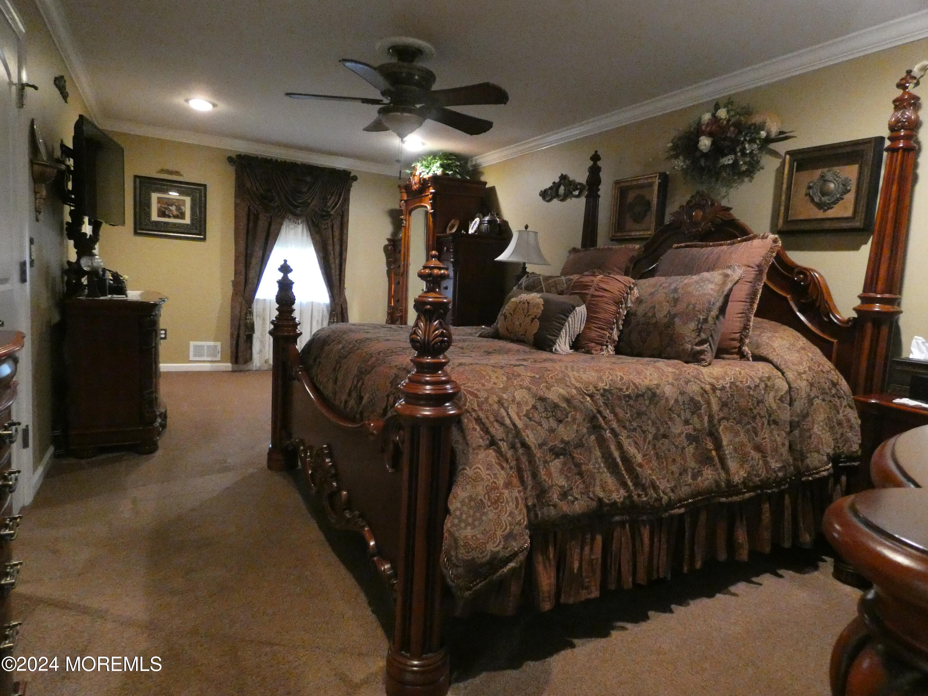 3 Springhill Drive Howell, NJ 07731 - Photo 18 of 37 a bedroom with bed and a chandelier