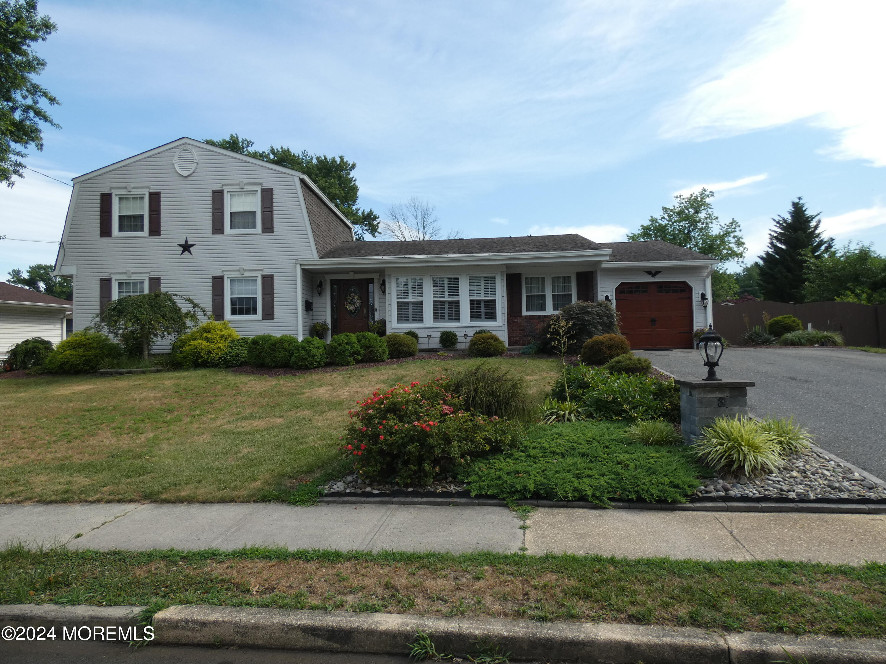 3 Springhill Drive Howell, NJ 07731 - Photo 2 of 37 a front view of a house with a yard
