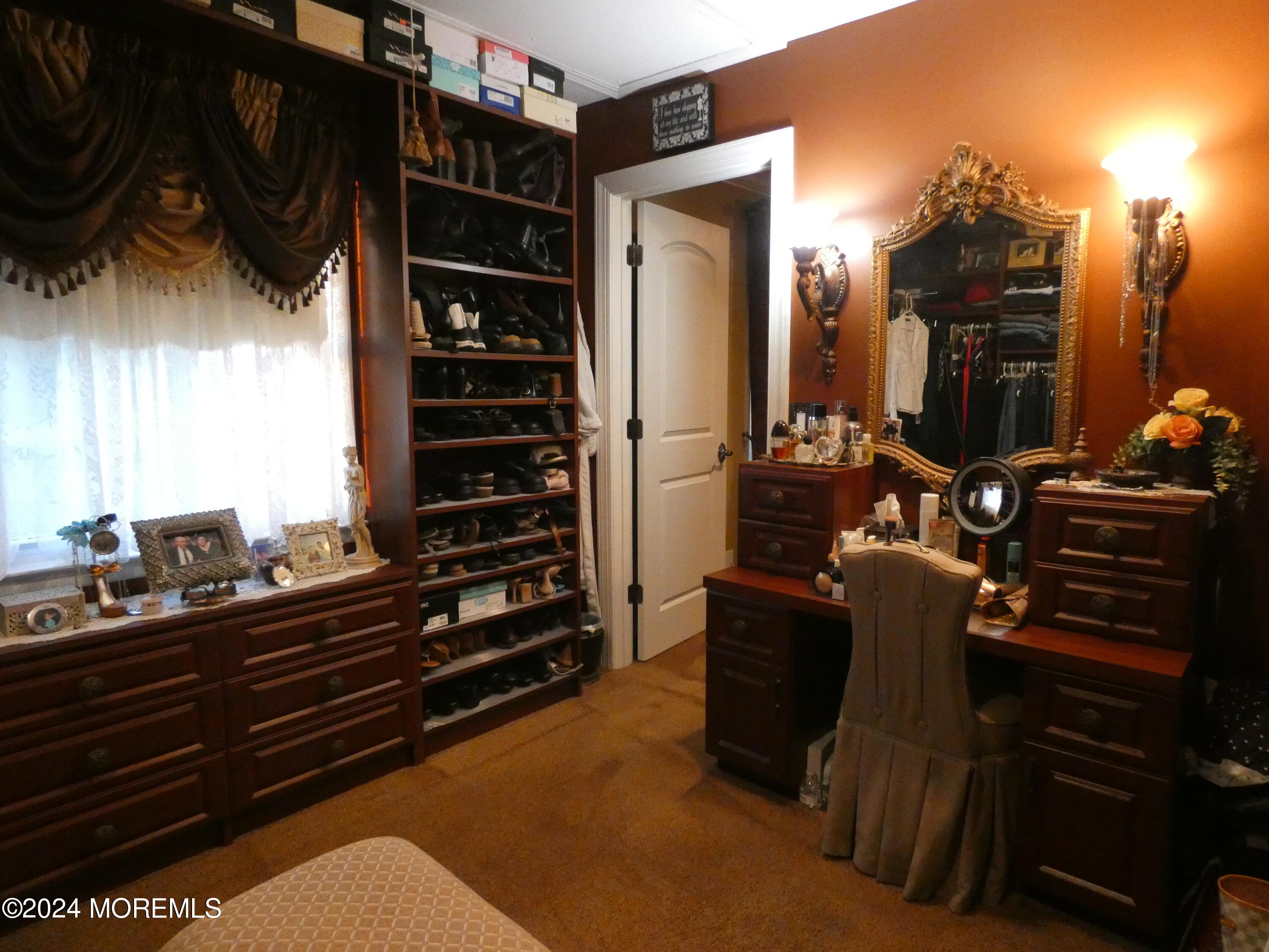 3 Springhill Drive Howell, NJ 07731 - Photo 21 of 37 a view of walk in closet with clothes and shoes