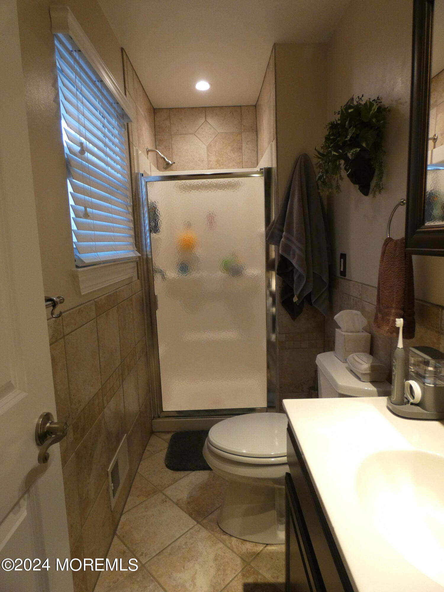 3 Springhill Drive Howell, NJ 07731 - Photo 27 of 37 a bathroom with a toilet and a shower