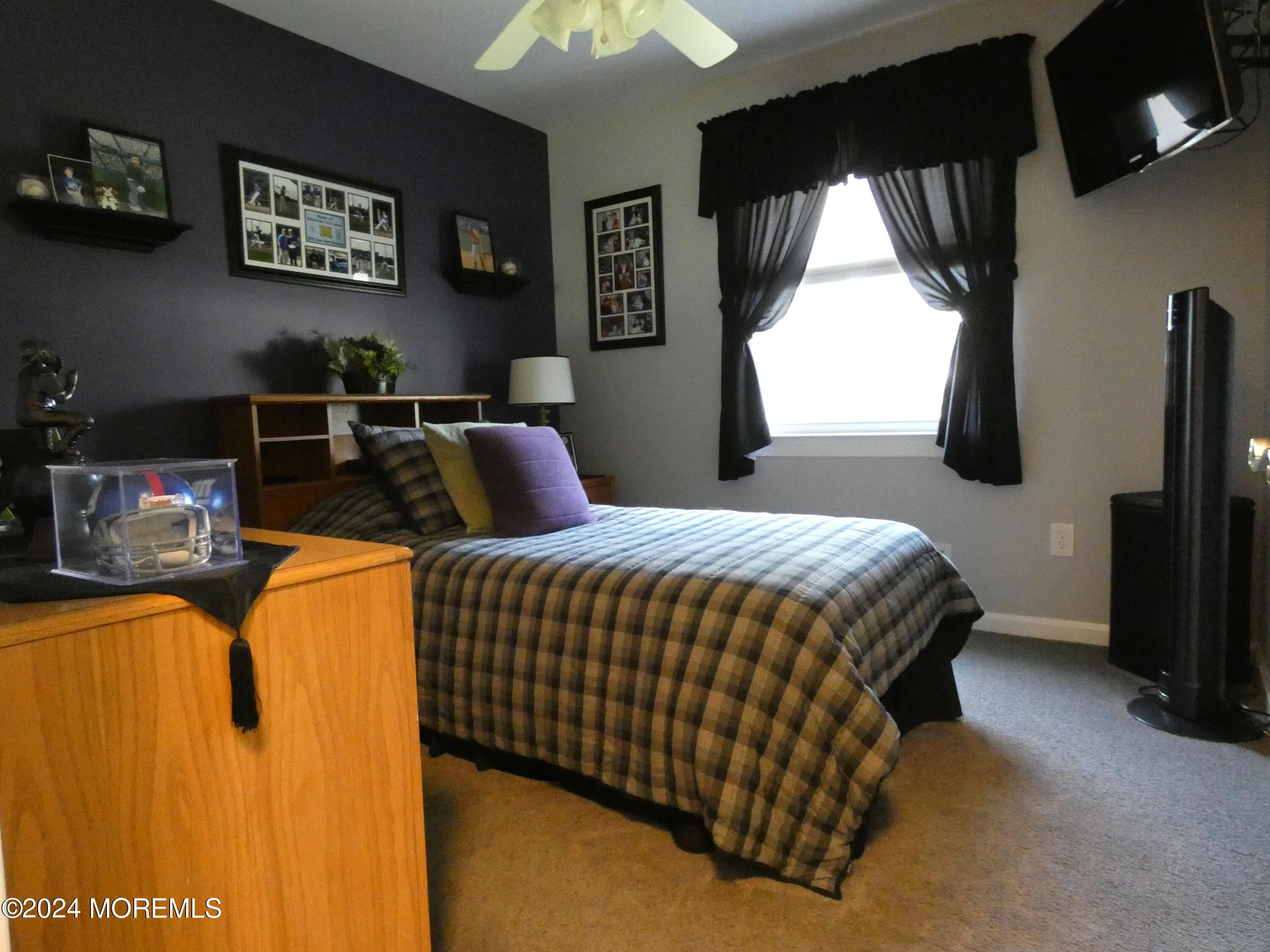 3 Springhill Drive Howell, NJ 07731 - Photo 30 of 37 a bedroom with a bed and a flat tv screen on the dresser