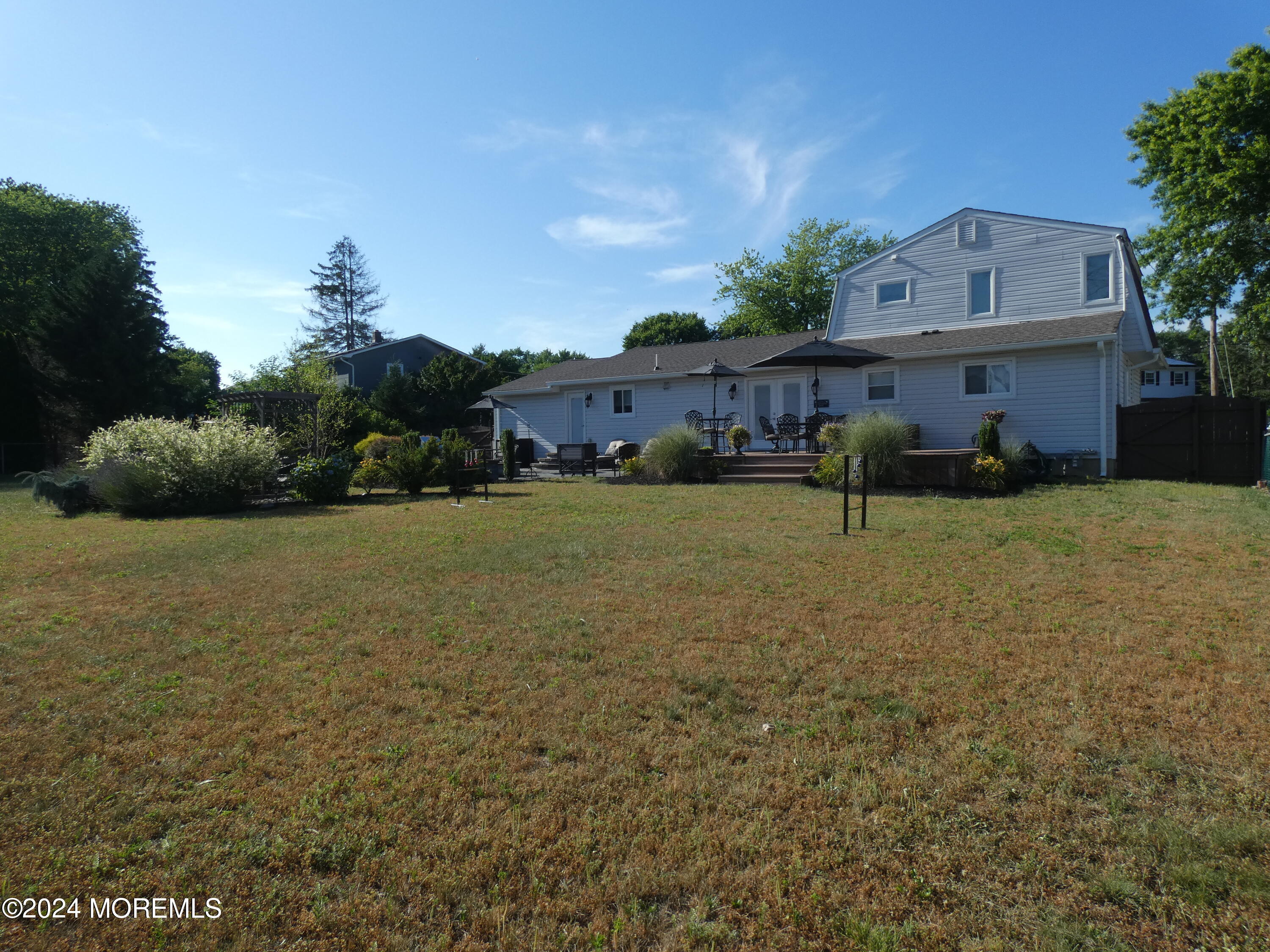 3 Springhill Drive Howell, NJ 07731 - Photo 35 of 37 a view of a house with a yard and potted plants
