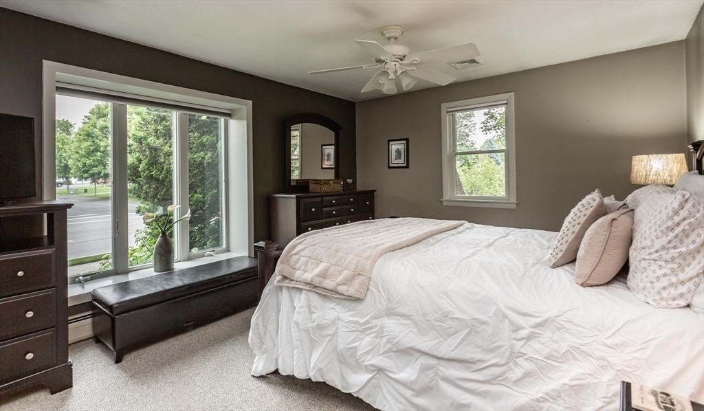 127 Howland Road Fairhaven, MA 02719 - Photo 17 of 42 a bedroom with a bed and a large window