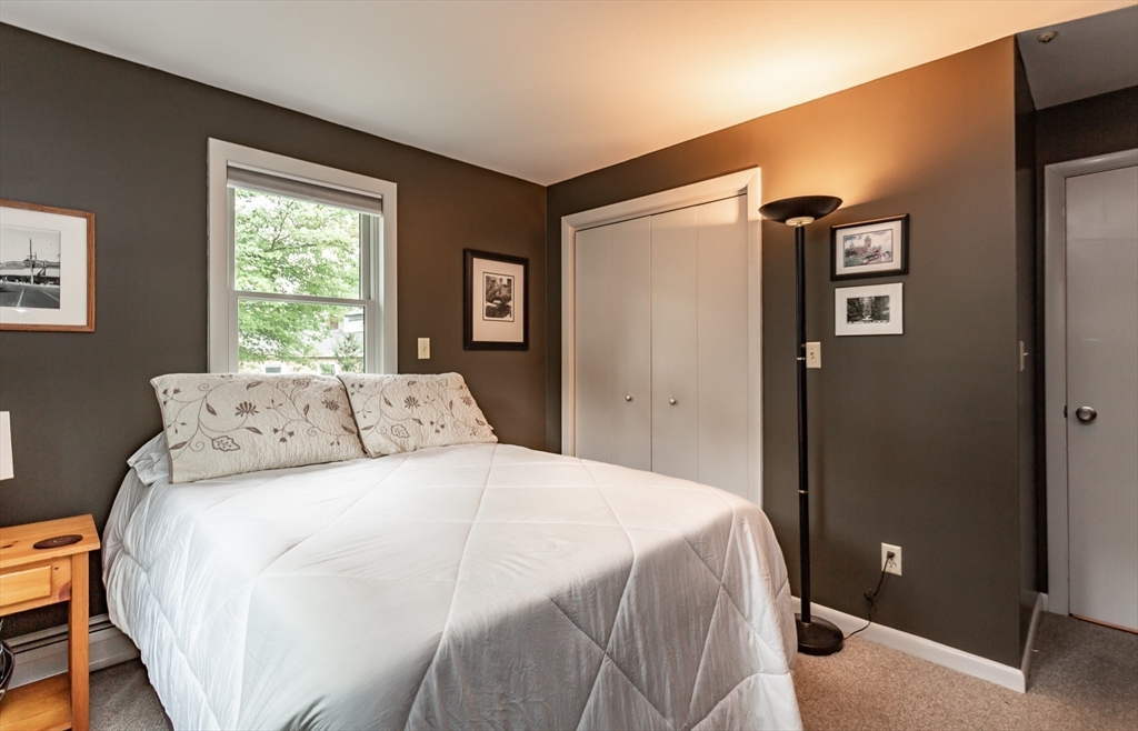 127 Howland Road Fairhaven, MA 02719 - Photo 24 of 42 a bedroom with a bed and a window