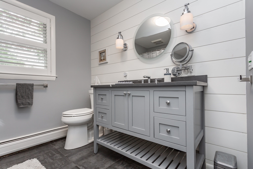 127 Howland Road Fairhaven, MA 02719 - Photo 25 of 42 a bathroom with a toilet a sink and mirror