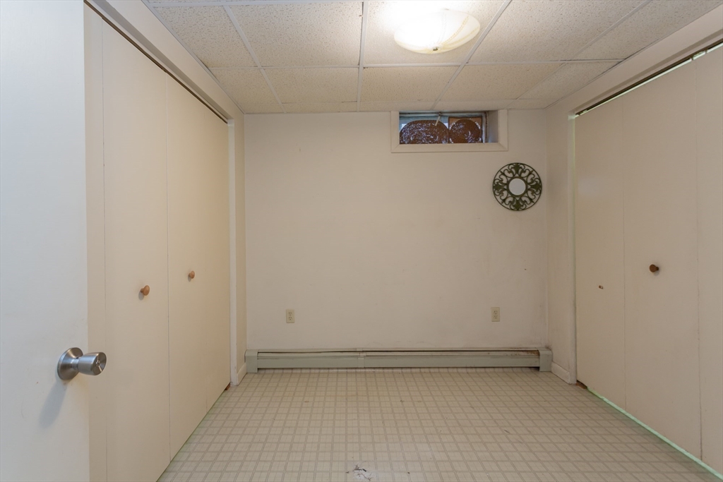 127 Howland Road Fairhaven, MA 02719 - Photo 31 of 42 a view of small space with racks on the wall