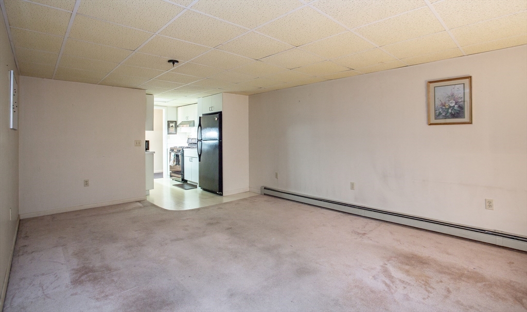 127 Howland Road Fairhaven, MA 02719 - Photo 34 of 42 a view of a kitchen with refrigerator and window