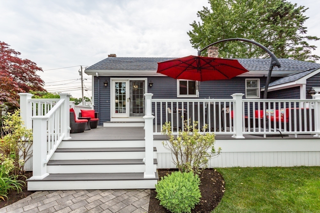 127 Howland Road Fairhaven, MA 02719 - Photo 36 of 42 a view of a house with a deck and furniture