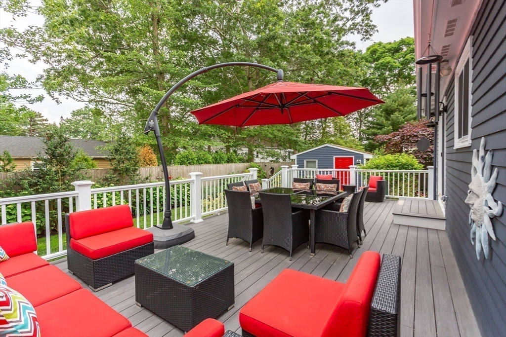 127 Howland Road Fairhaven, MA 02719 - Photo 37 of 42 an outdoor sitting area with furniture and wooden deck