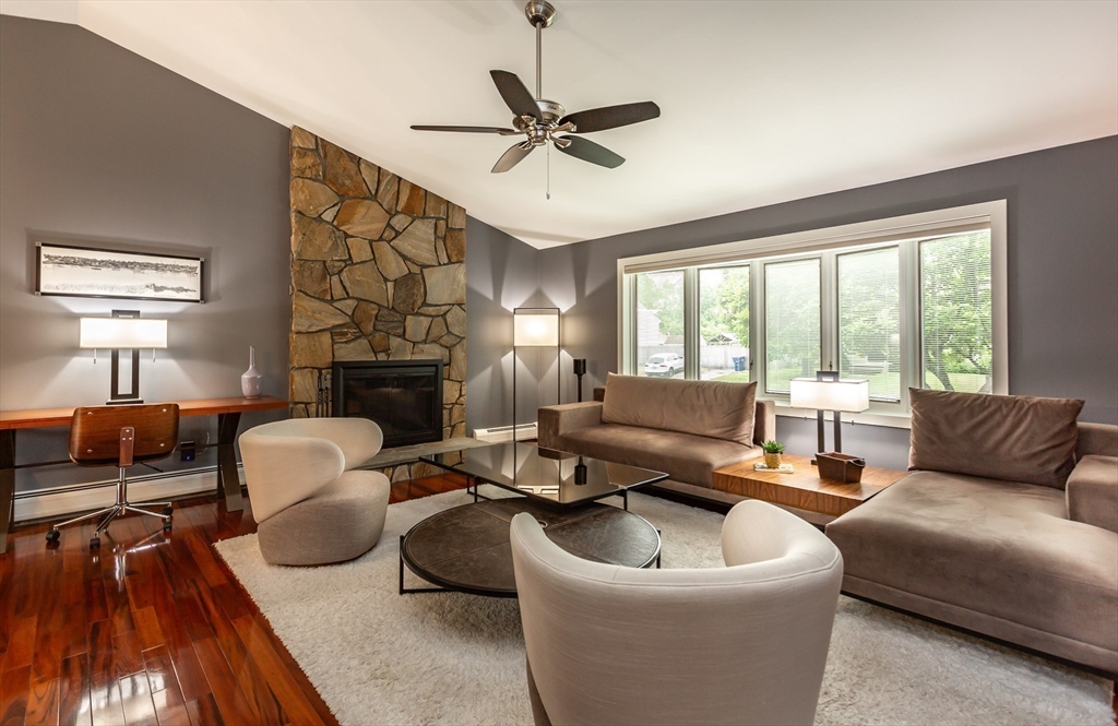 127 Howland Road Fairhaven, MA 02719 - Photo 4 of 42 a living room with furniture fireplace and a large window