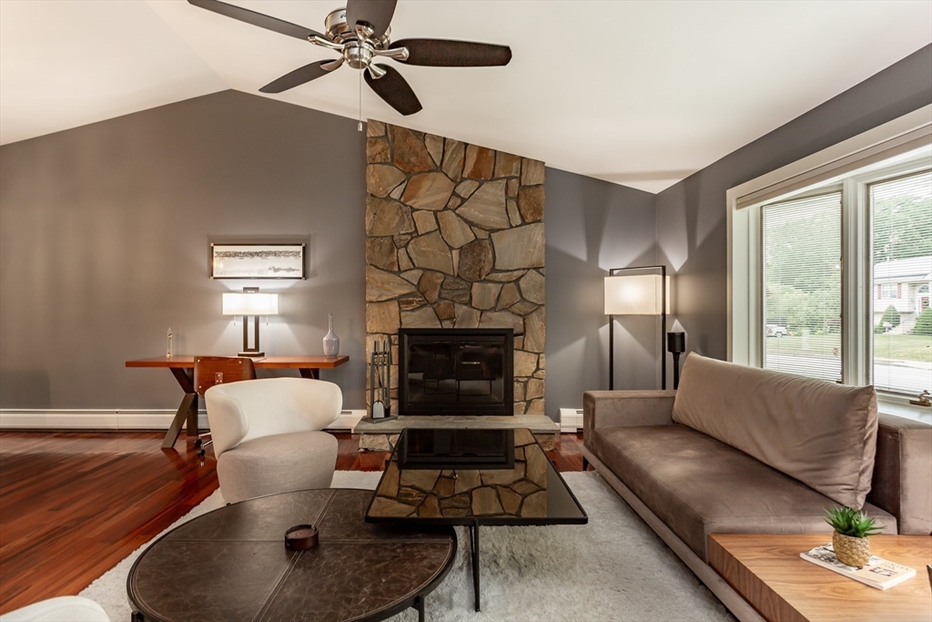 127 Howland Road Fairhaven, MA 02719 - Photo 5 of 42 a living room with furniture and a fireplace