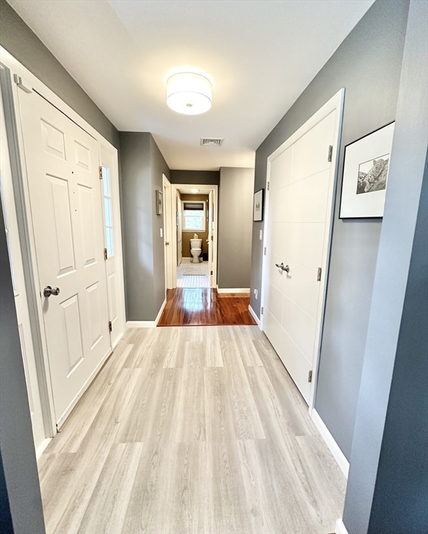 127 Howland Road Fairhaven, MA 02719 - Photo 8 of 42 a view of a bedroom with wooden floor and bedroom