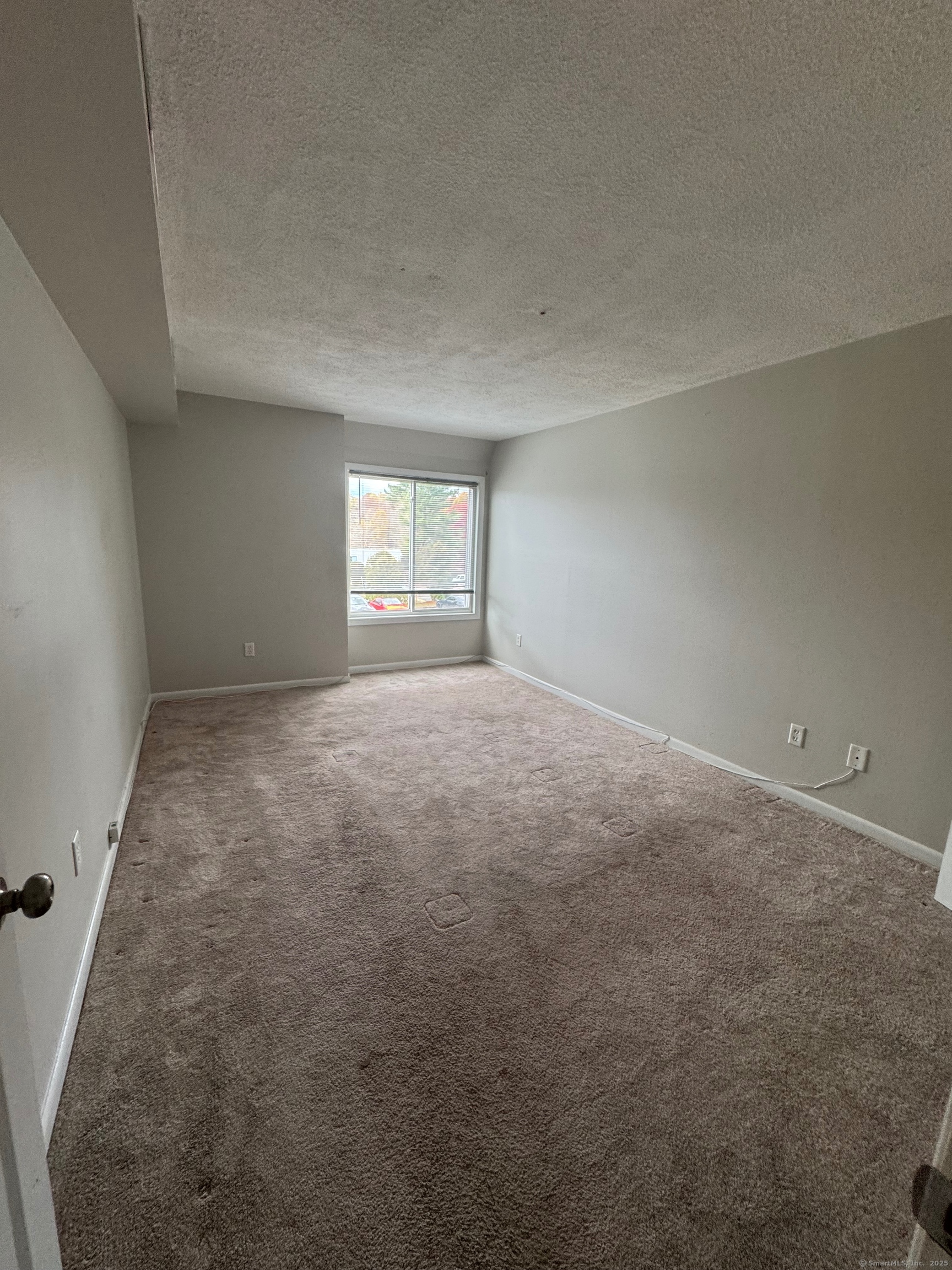 12 Cedar Court, Unit I East Haven, CT 06513 - Photo 4 of 9 an empty room with a window