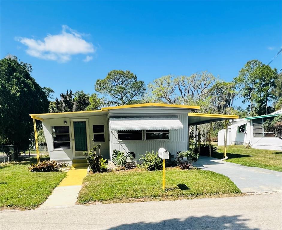 6629 Statice Lane New Port Richey, FL 34652 - Photo 1 of 1 a view of a house with backyard porch and sitting area