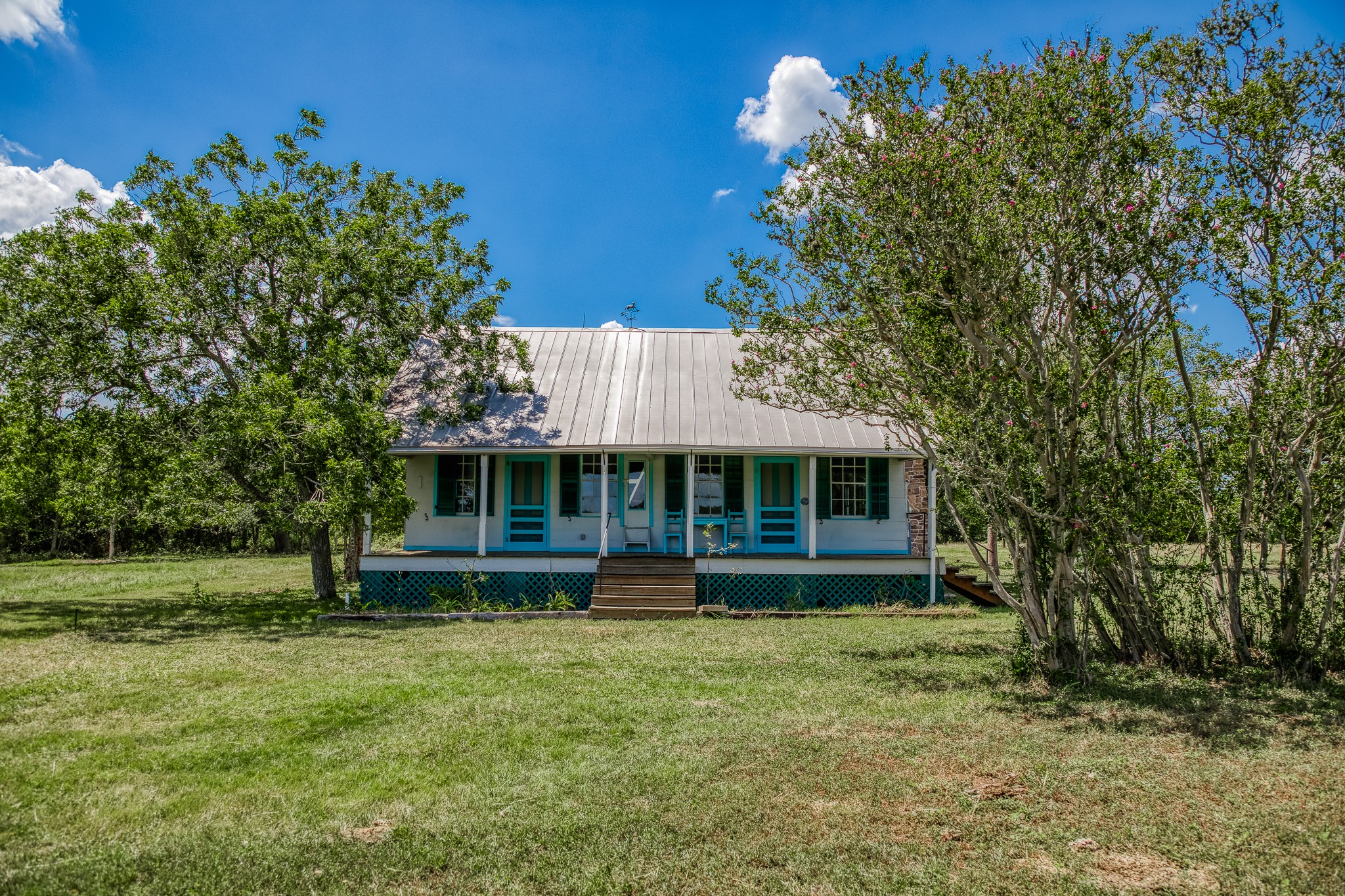 3420 Rohde Road Round Top, TX 78954 - Photo 17 of 28 a front view of a house with a garden