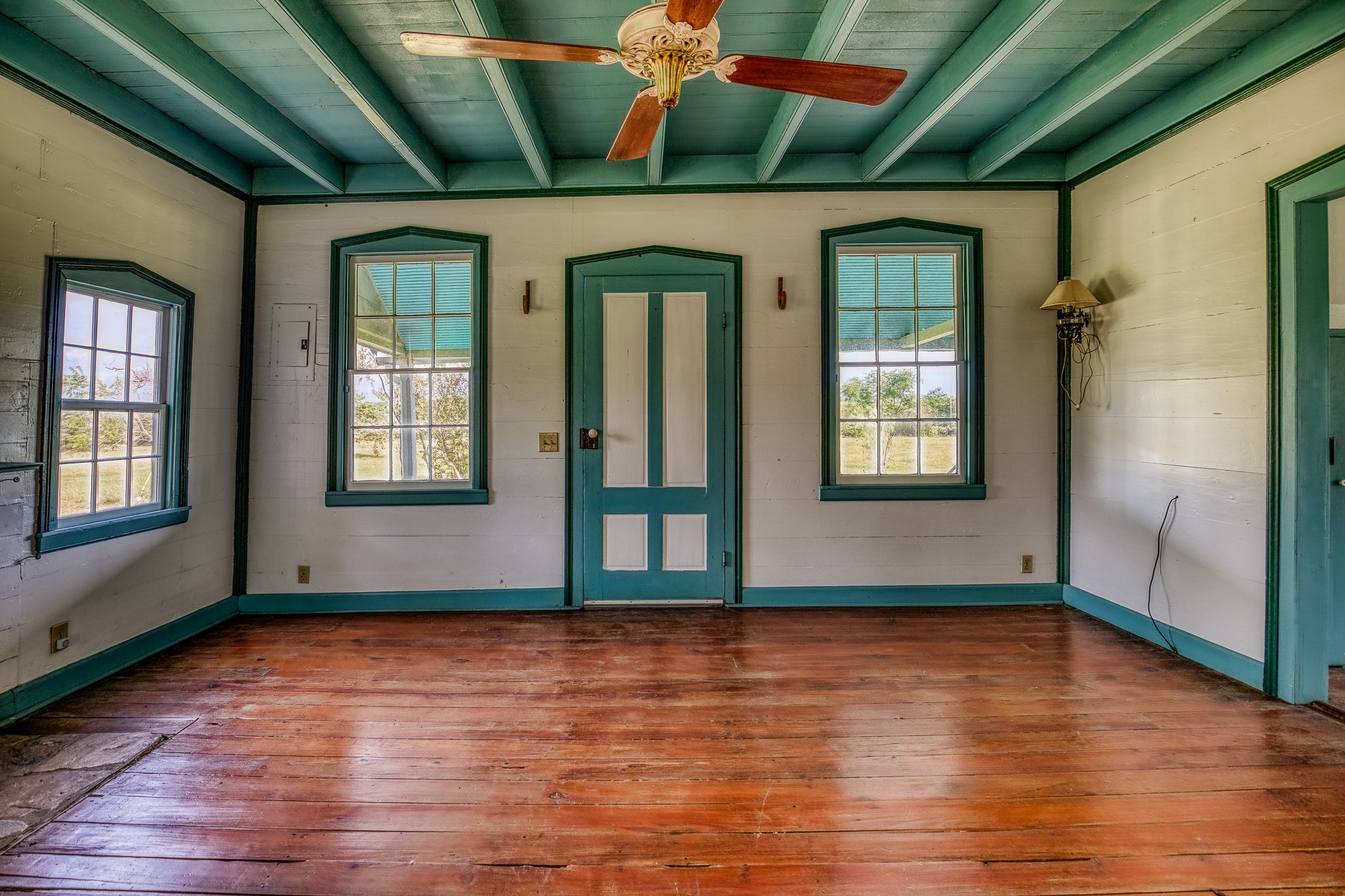 3420 Rohde Road Round Top, TX 78954 - Photo 19 of 28 a view of empty room with wooden floor and fan