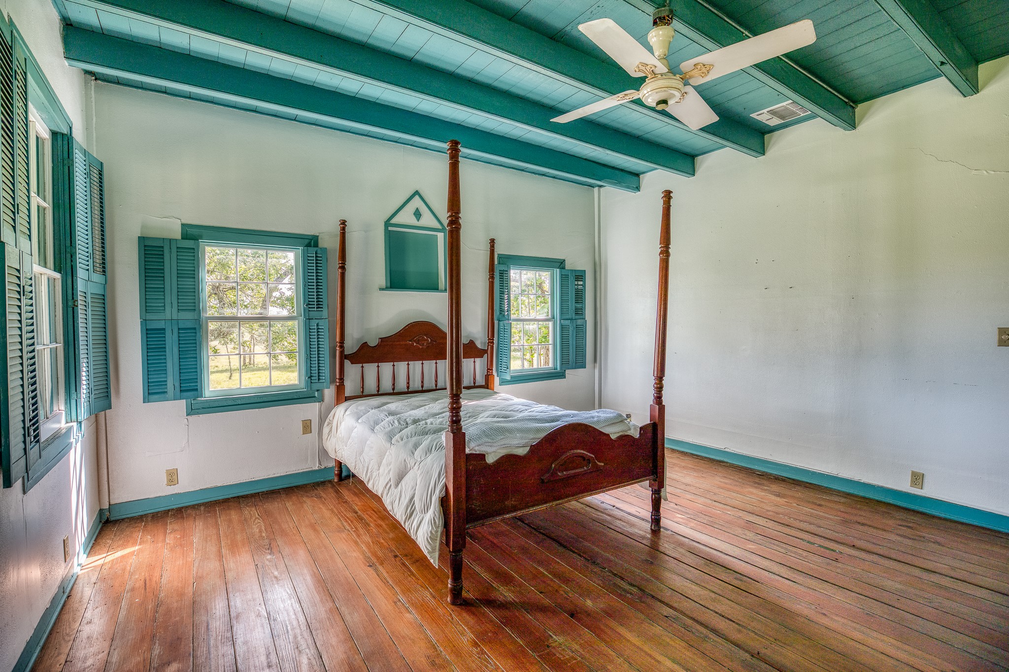 3420 Rohde Road Round Top, TX 78954 - Photo 22 of 28 a bed sitting in a bedroom next to a window