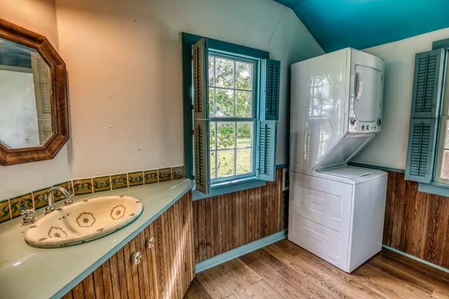 a view of a door and wooden floor