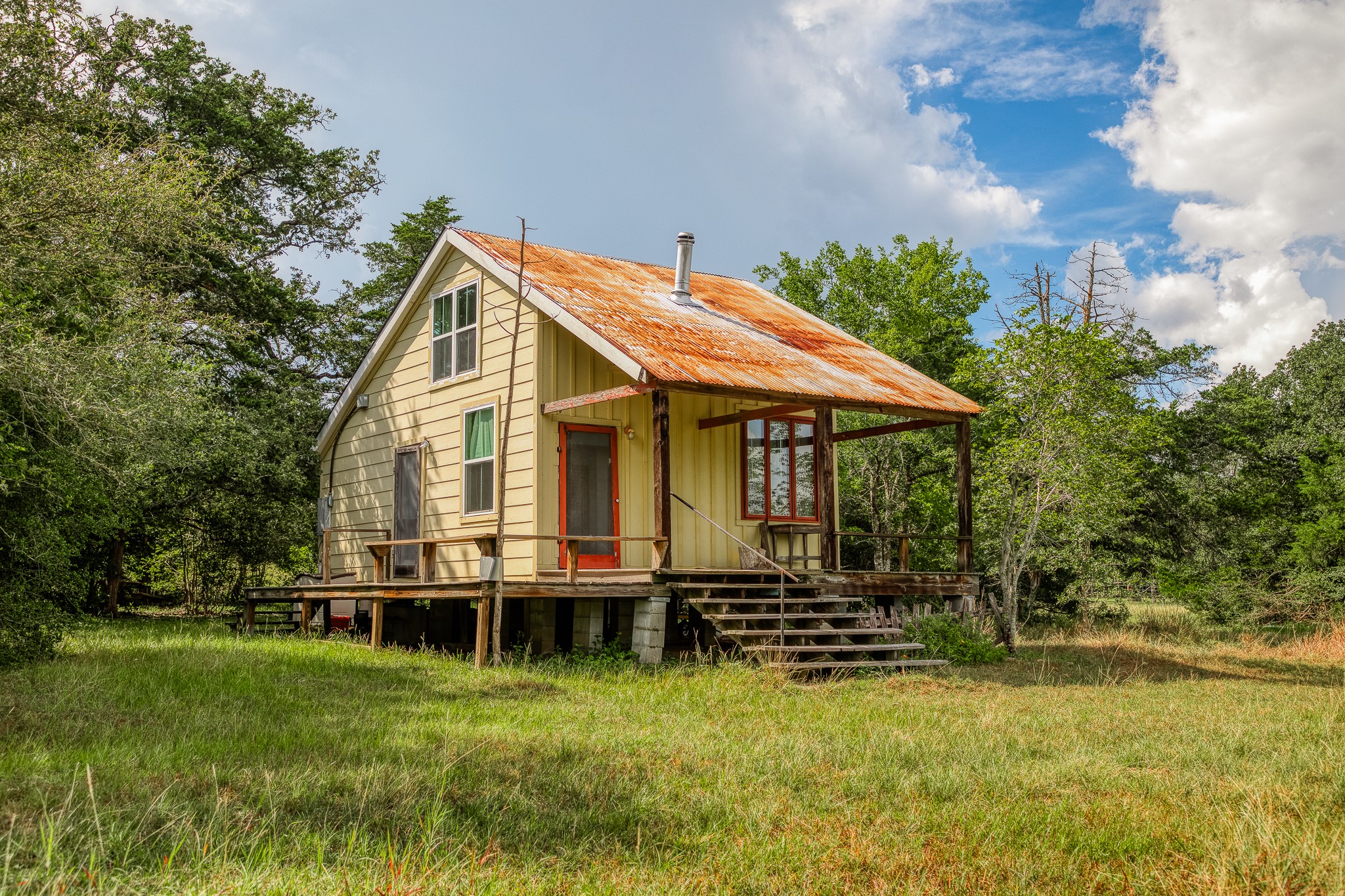 3420 Rohde Road Round Top, TX 78954 - Photo 28 of 28 a backyard of a house with yard table and chairs